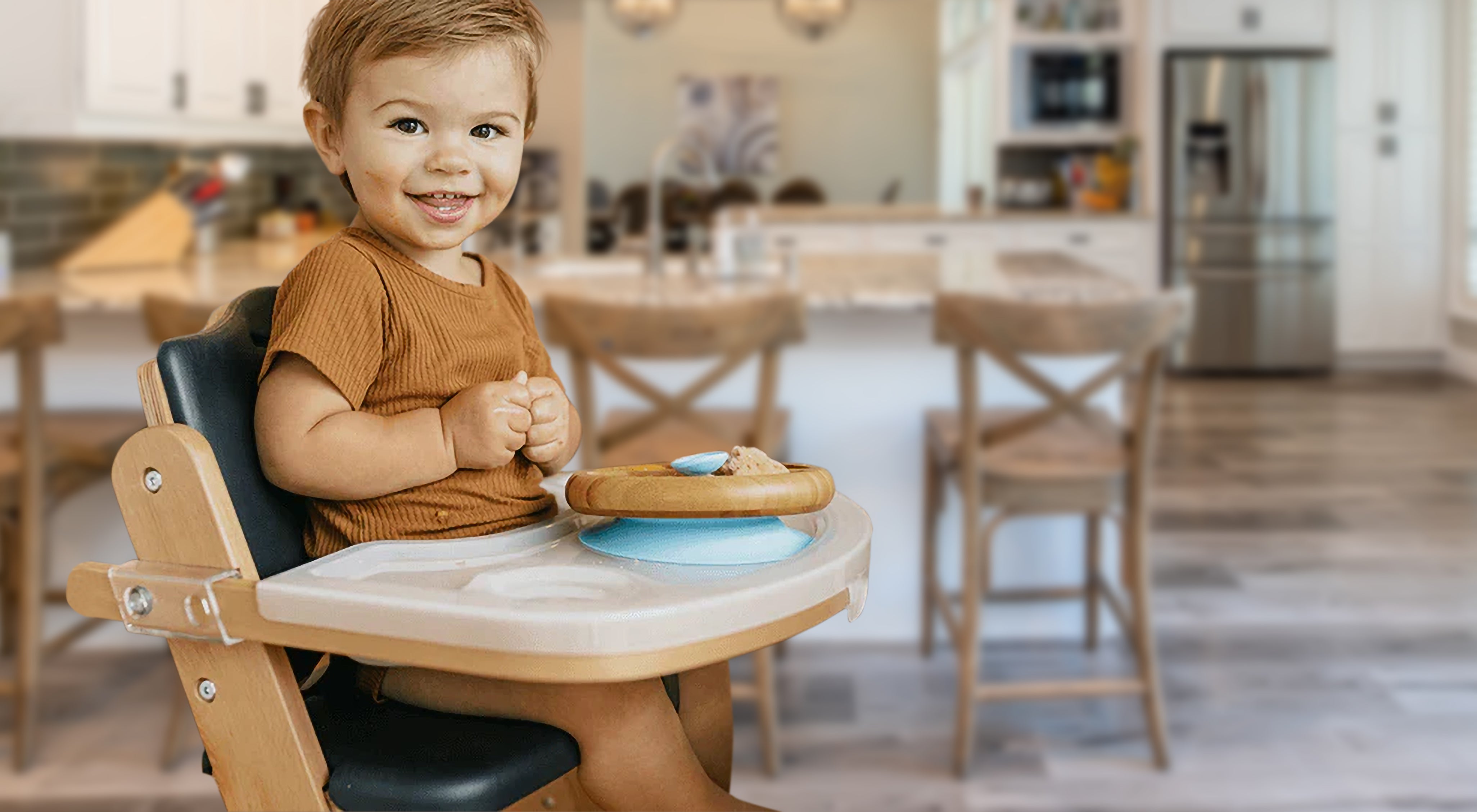 baby smiling in Beyond Junior® Y High Chair