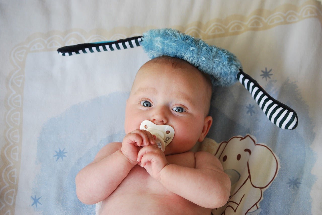 baby with pacifier in mouth