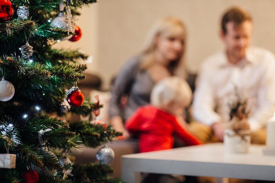 christmas tree with family in background