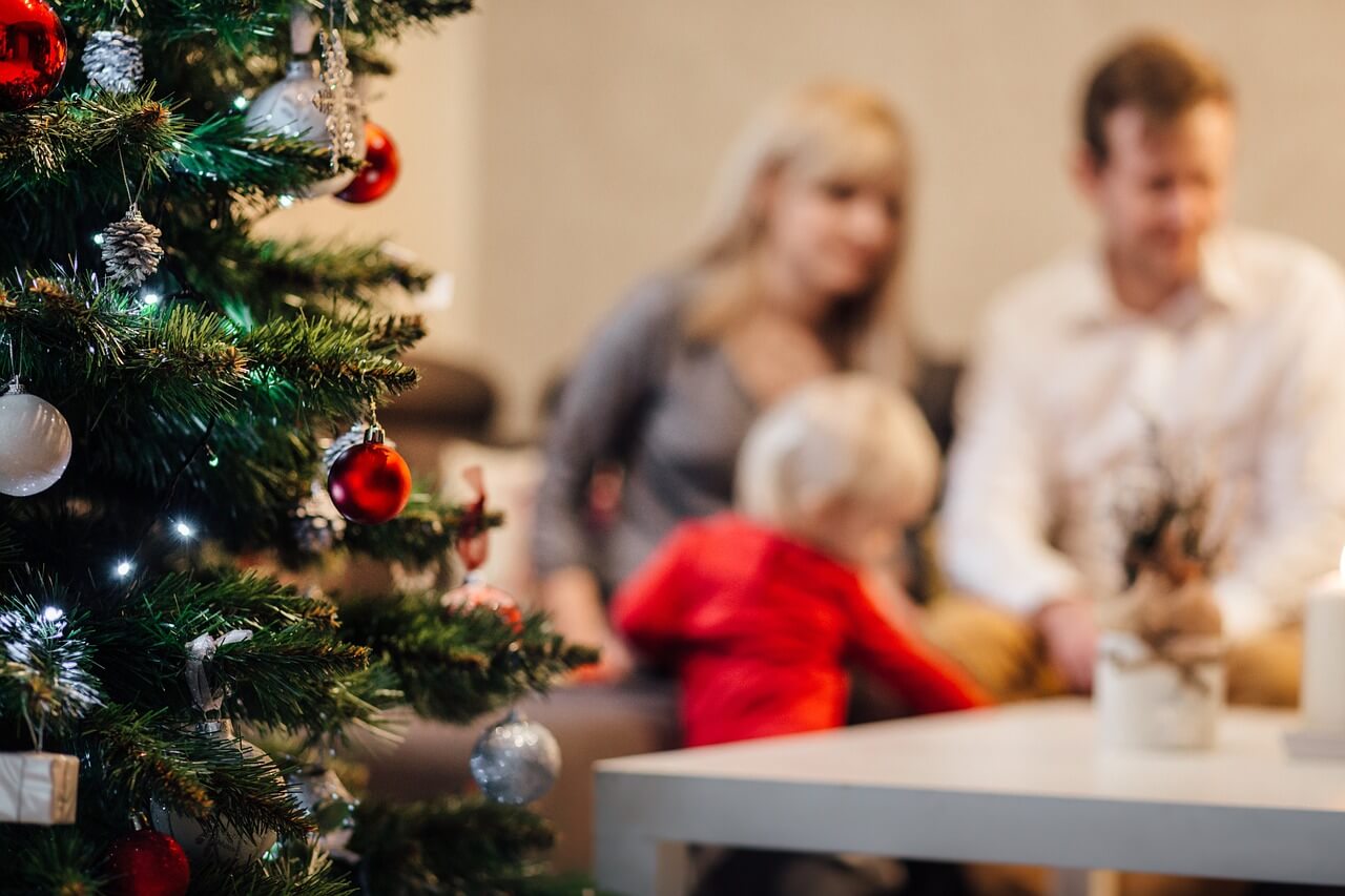 christmas tree with family in background