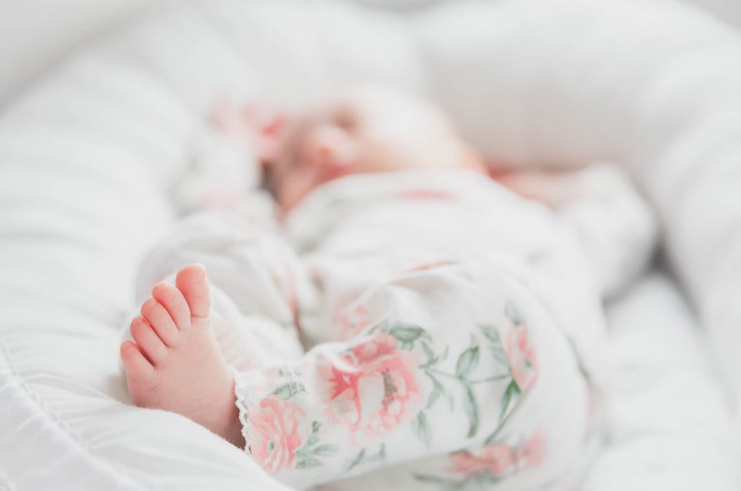 Sleeping baby wearing floral attire