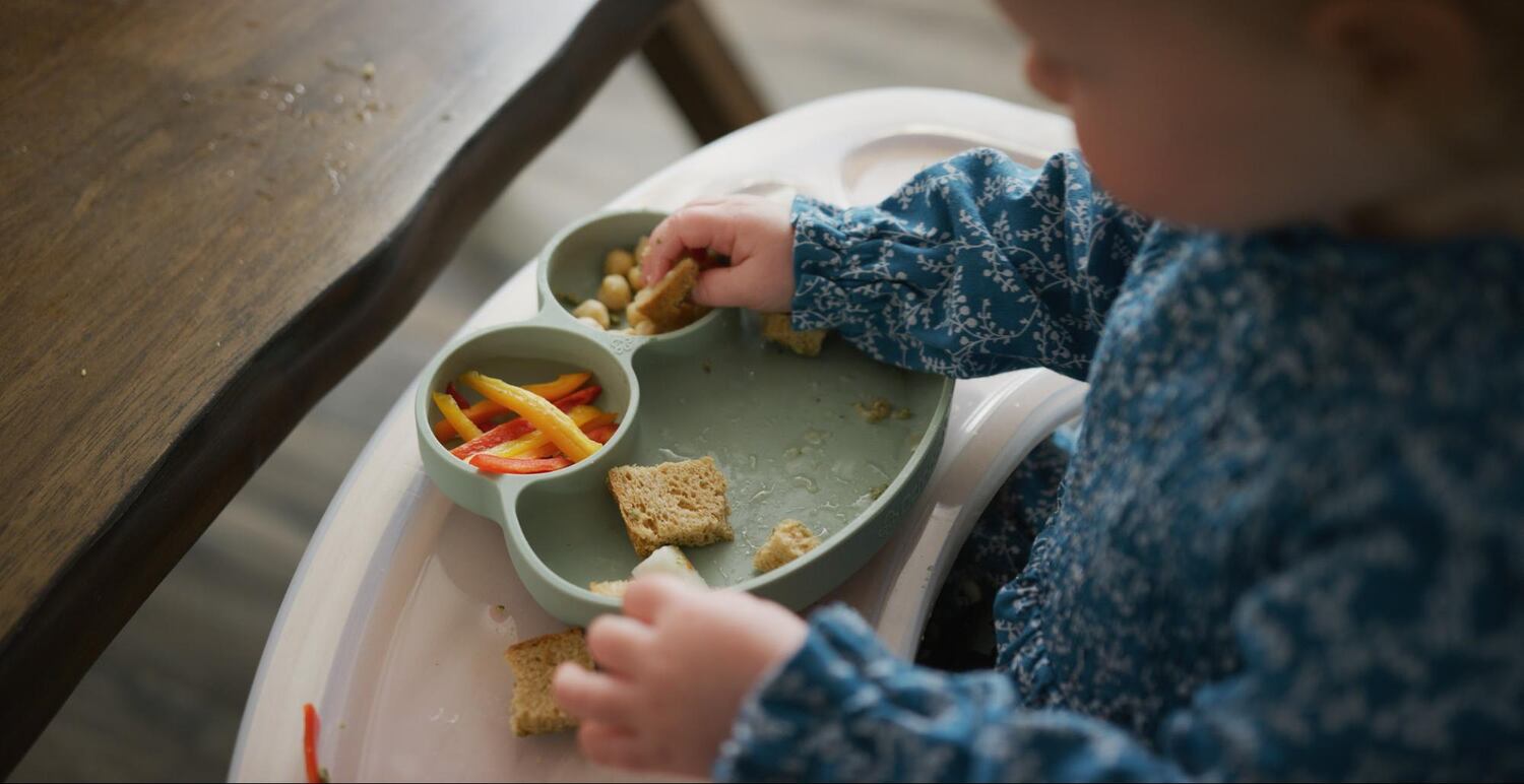 Toddler eating from silicone suction dish