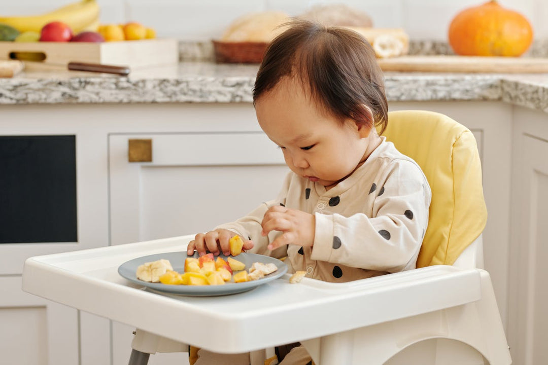 Toddler sitting on high chair