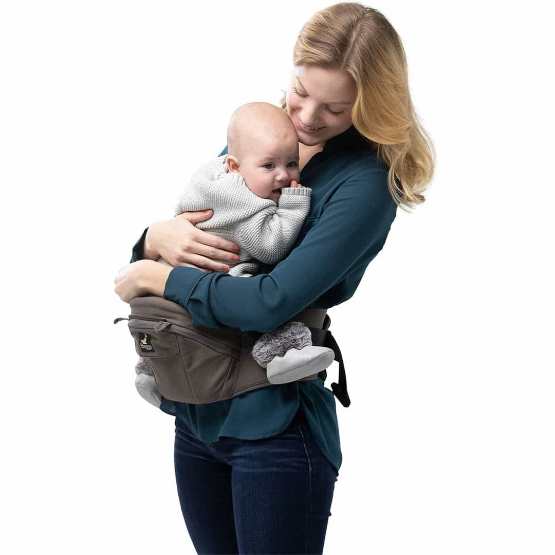 Mom safely holding her baby with baby carrier