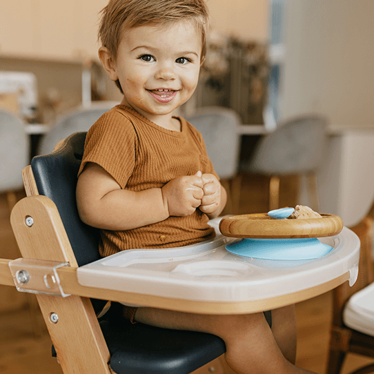 Natural olive variant of the Abiie Beyond Junior High Chair